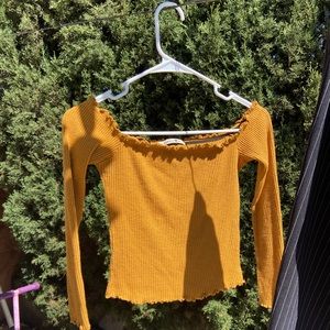 Long-sleeved crop top.